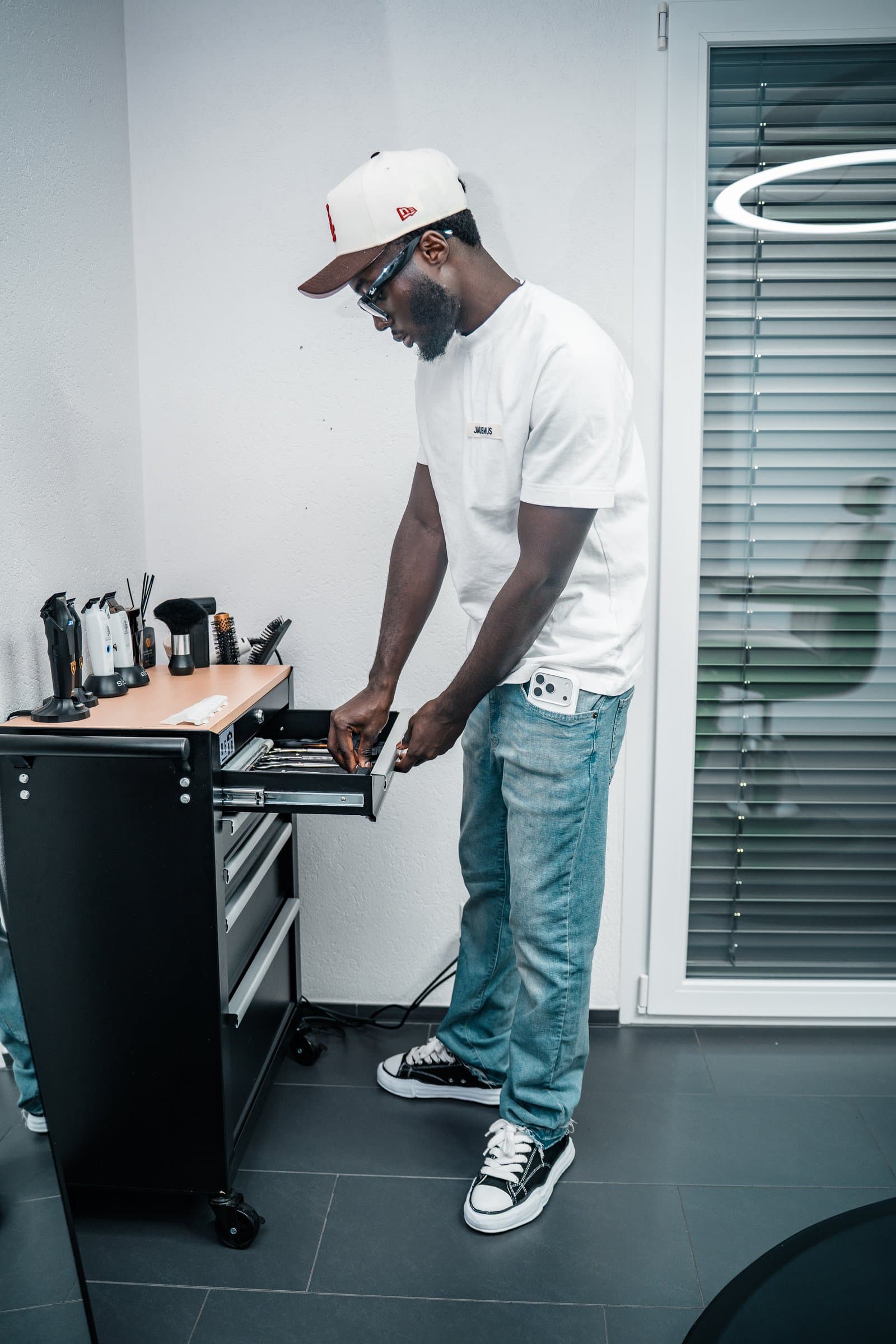 Abdoulaye opening his tool drawer